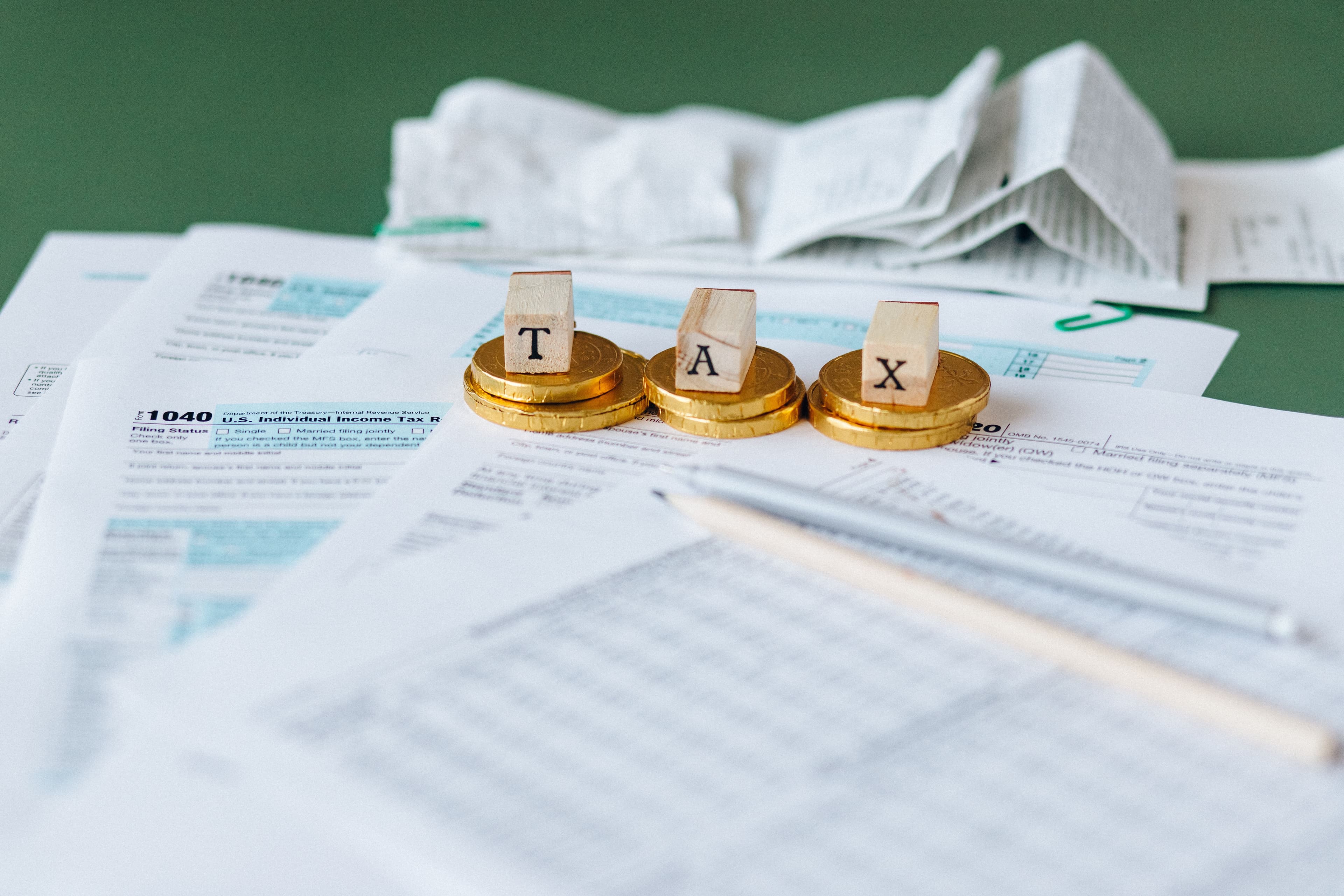 Regulatory documents and a calculator on an office desk